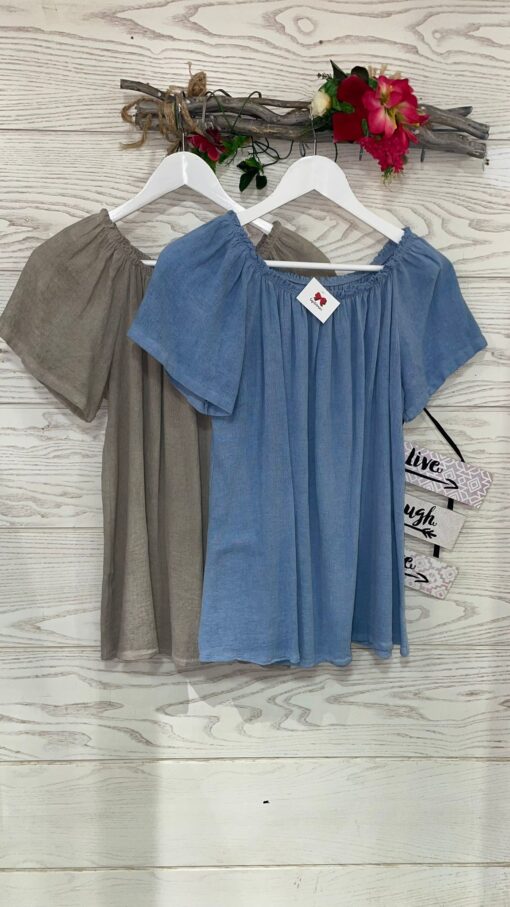 Blusa con escote de barco y manga corta. Idea para un look fresco para el verano.