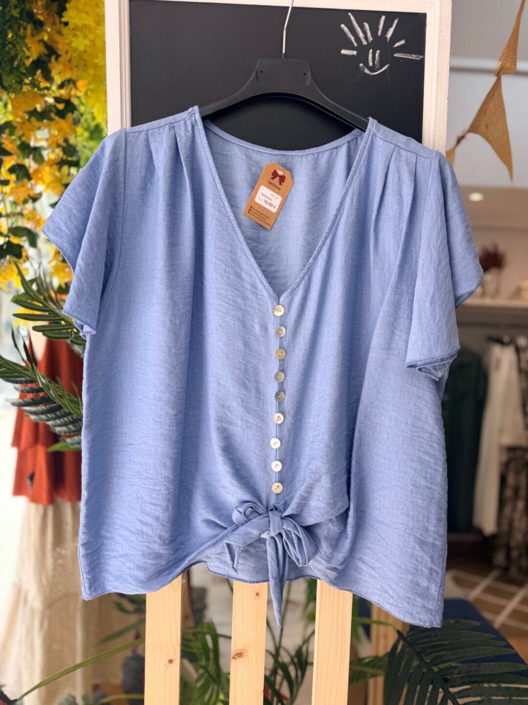Blusa de botones y nudo