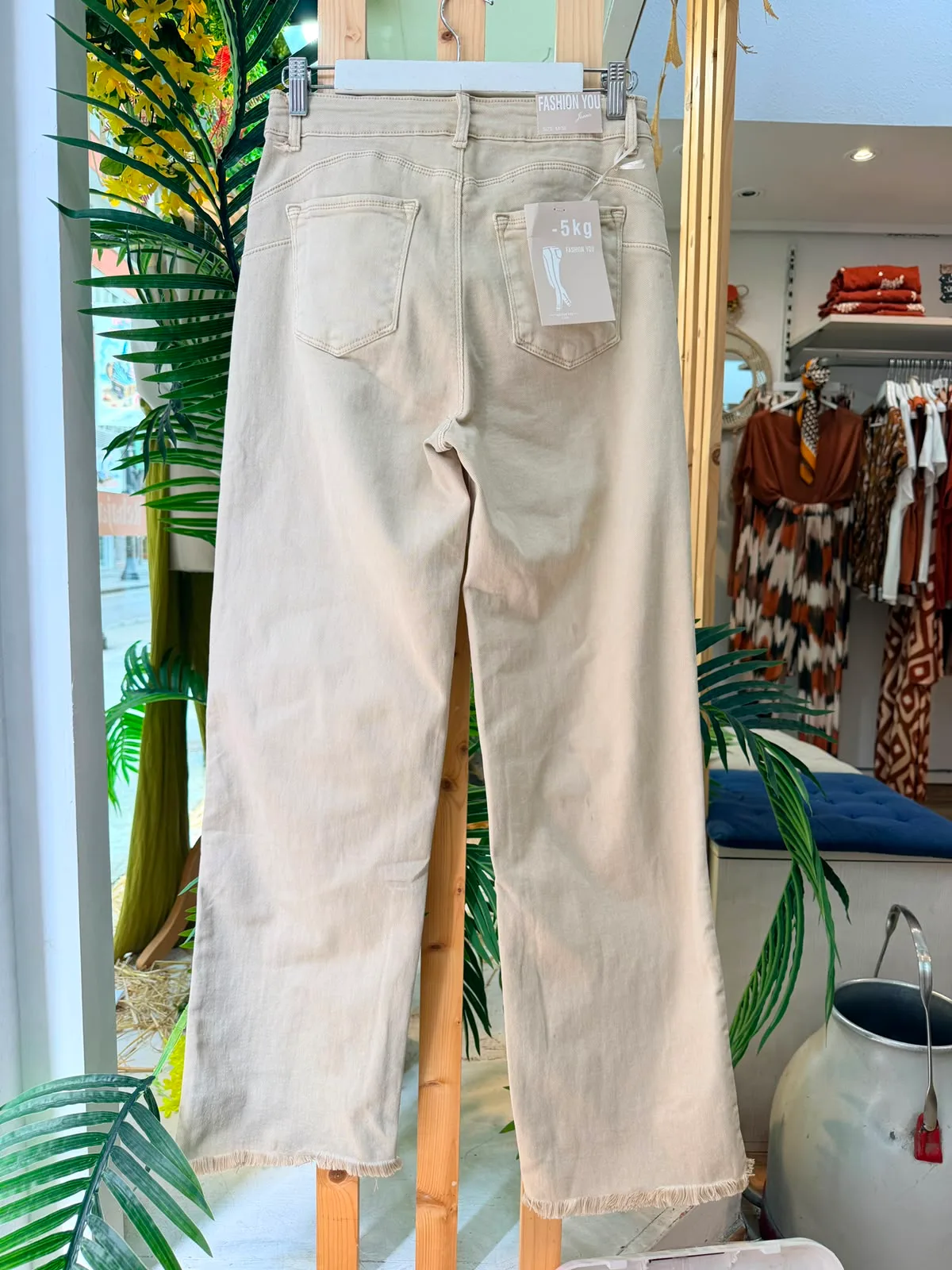 Pantalón con flecos bolsillos