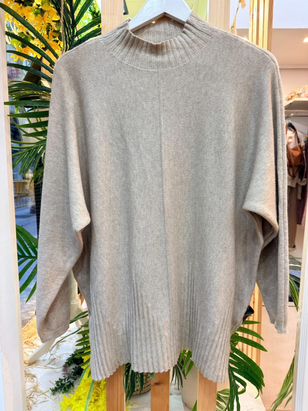 Jersey oversize con bajo asimétrico